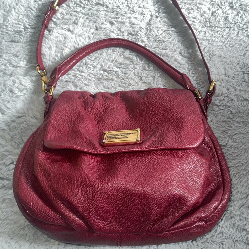 Marc by Marc Jacob’s leather bag in a burgandy bag.